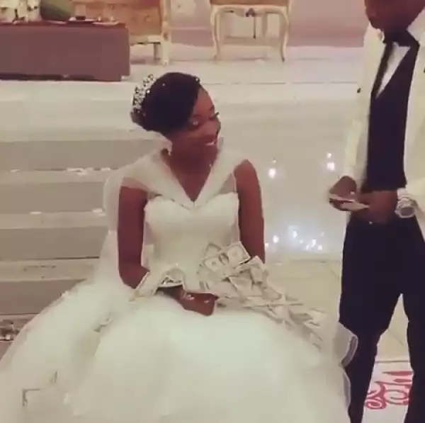 See How Husband Showers Wife With Dollars At Their Wedding Reception